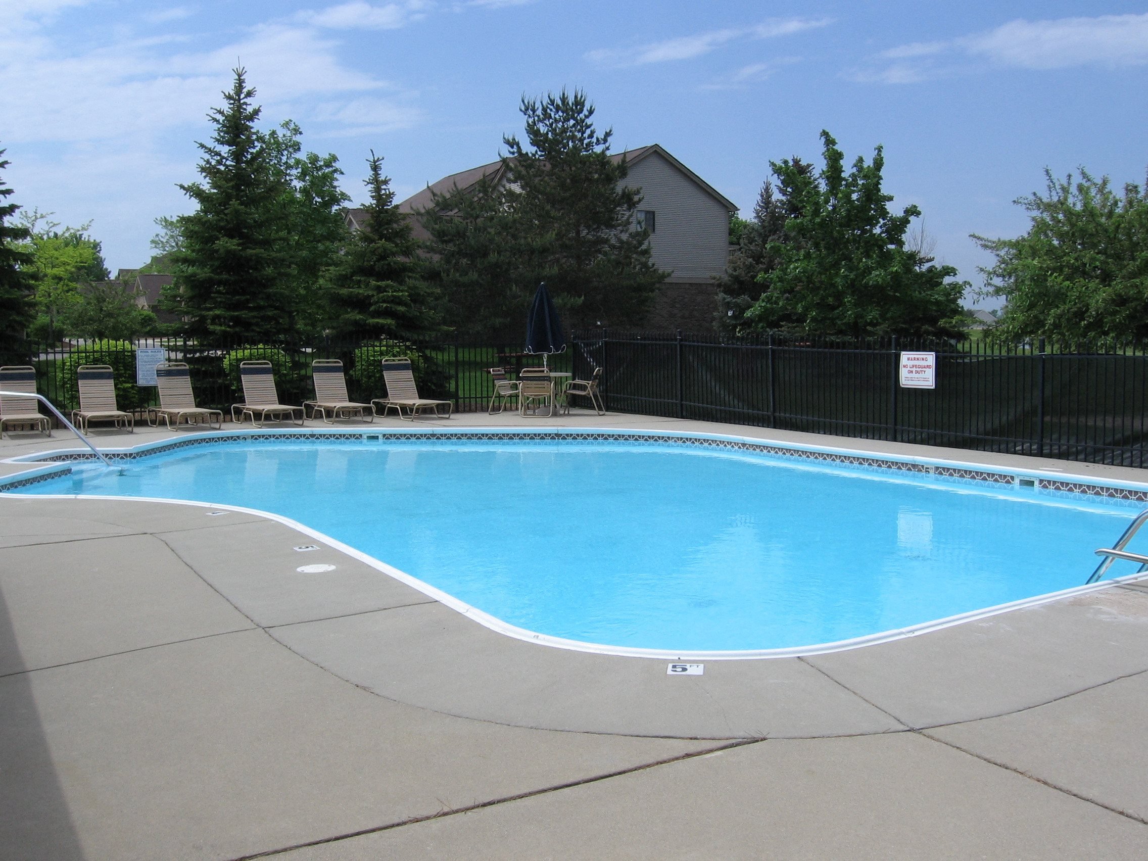 Heated Pool, with plenty of lounge chair sunning, umbrella tables, and shower locker rooms and private restrooms. The Playground and picnic area is located just outside the pool area.